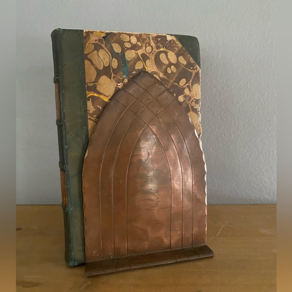 Hand-crafted copper bookends with an arched design, from Vermont.